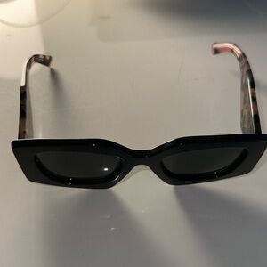 Prada women’s black and pink Milano sunglasses